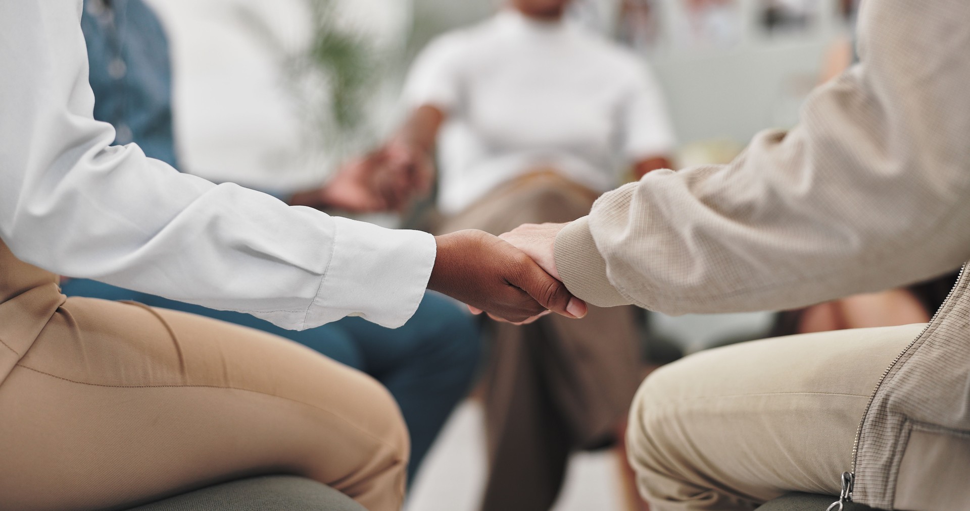 Hands, group and therapy in circle, support and listening with trust, advice and empathy with kindness. People, community and wellness for mental health, counselling or consultation in meeting